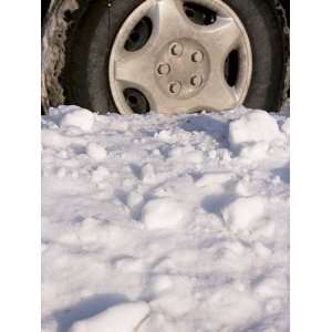  Close Up of a Vehicle Tire Stuck in Snow Drifts in Winter 