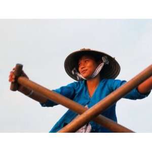  Woman Rowing Across the Mekong River, Can Tho, Vietnam 