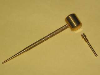 Brass Mallet (Hammer) and Supplemental Pin. Pin is stored in Mallet 