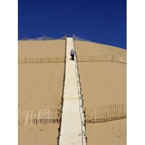  Man Climbing Steps Leading Up to Dunes Du Pyla, Bay of Arcachon 