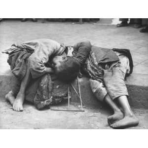 com Two Young Children Dying Together in Gutter During Famine, Unable 