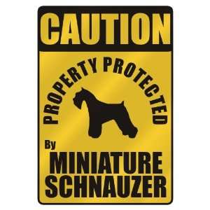 CAUTION  PROPERTY PROTECTED BY MINIATURE SCHNAUZER  PARKING SIGN DOG