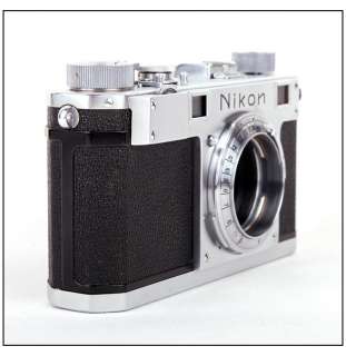 Mint  Nikon S rangefinder film camera in silver w/leather case 
