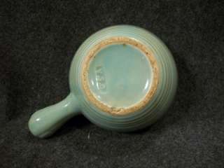   for sale is a green stoneware soup bowl with handle from USA Pottery