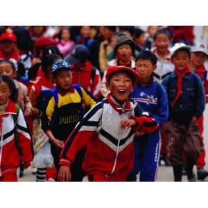  Group of School Children on Main Street of Daocheng, China 