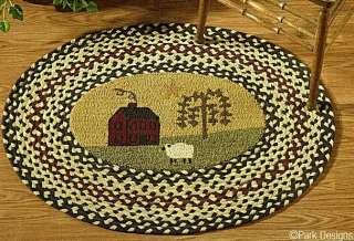 This oval braided/hooked rug featuring a Red Saltbox house   Willow 
