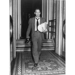  Sen. Harry P Cain, Smoking a Cigarette, Carrying His Shoes 
