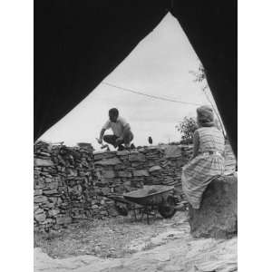  Author Lawrence Durrell Building a Stone Wall Near His 
