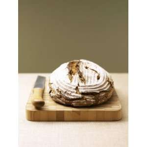 Bauernbrot (German Farm Bread) on Wooden Board with Knife Photographic 